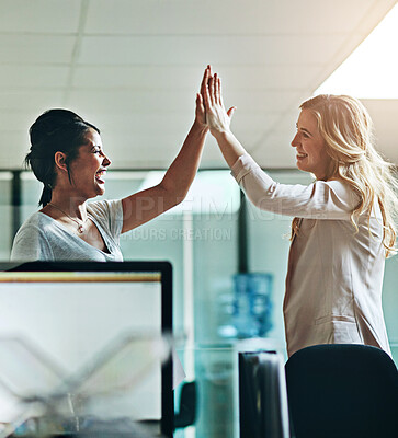 Buy stock photo Teamwork, support and happy colleagues sharing high five in a modern office, excited about good news or feedback. Female coworkers celebrating success, expressing joy and collaborating on project