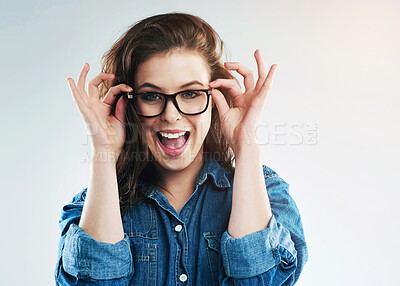 Buy stock photo Woman, glasses and eyesight in studio eyesight with smile, excited or wellness with vision by white background. Girl, person and happy for frame, check or eye test for optometry assessment for health