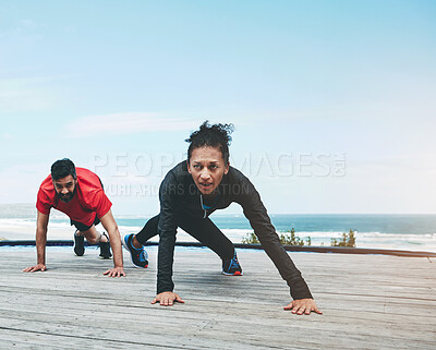 Buy stock photo Couple, stretching and legs for fitness outdoor with warm up, blue sky and morning activity for flexibility on floor. People, exercise and teamwork by ocean with wellness, mockup and active 