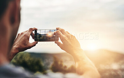 Buy stock photo Sunset, photography and hands of man with phone, screen and post on social media with nature, landscape or sun. Cellphone, photo and person with tech for memory of vacation, holiday or outdoor view