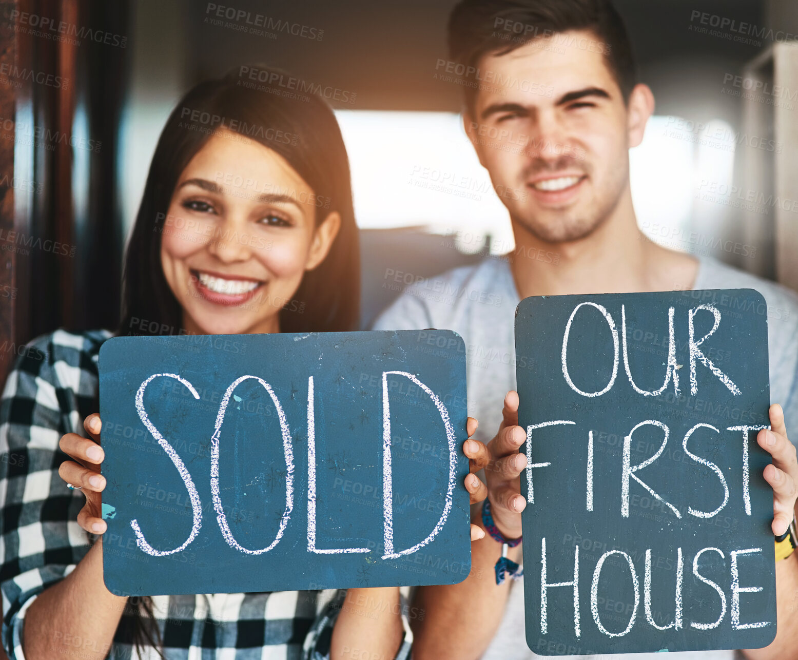 Buy stock photo Couple, sold sign and portrait by front door of new house with smile, property investment and homeowner. Achievement, happy people and dream home purchase with success board in doorway for sale