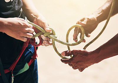 Buy stock photo Rock climbing, nature and hands of people with rope for training, exercise and outdoor extreme sports. Fitness, travel and friends with harness, equipment or gear for adventure, workout and challenge