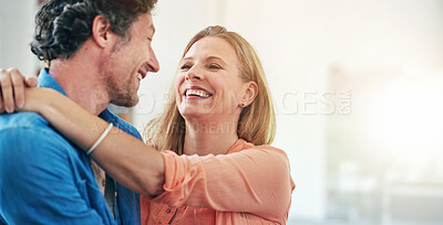 Buy stock photo Couple, hug and smile in morning, home and excited for chat with bonding for love with connection. People, man and woman with embrace for care, happy and kindness in relationship with trust in house