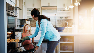 Buy stock photo Mother, daughter and cookies in oven for baking in kitchen with learning, bonding and fun in home with sunlight. Family, woman and girl with cooking dessert, cake and sweet snack by stove in house