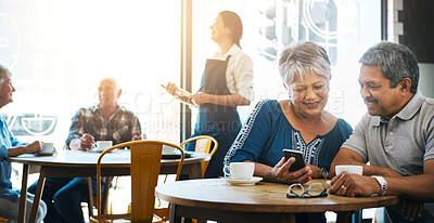 Buy stock photo Elderly couple, restaurant and table together for bonding, smartphone and talking or browsing and online search. Internet, relationship and coffee shop for relax lunch, date and reading blog