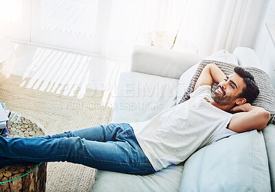 Buy stock photo Man, relax and sofa in home with smile or comfortable peace in living room for afternoon, resting or day off. Male person, couch and leisure in England apartment with lazy Saturday, lying or happy