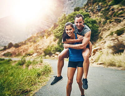 Buy stock photo Couple, road and happy with piggyback for fitness on portrait, support and love in California. Workout, exercise and active with jogging for health or wellness and morning run for wellbeing in smile