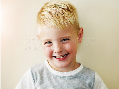 Buy stock photo Portrait, boy and smile in studio for wellness and happiness,  cute and excited face on white background. Kid, confidence and positive for childhood development, joyful and relaxed expression 