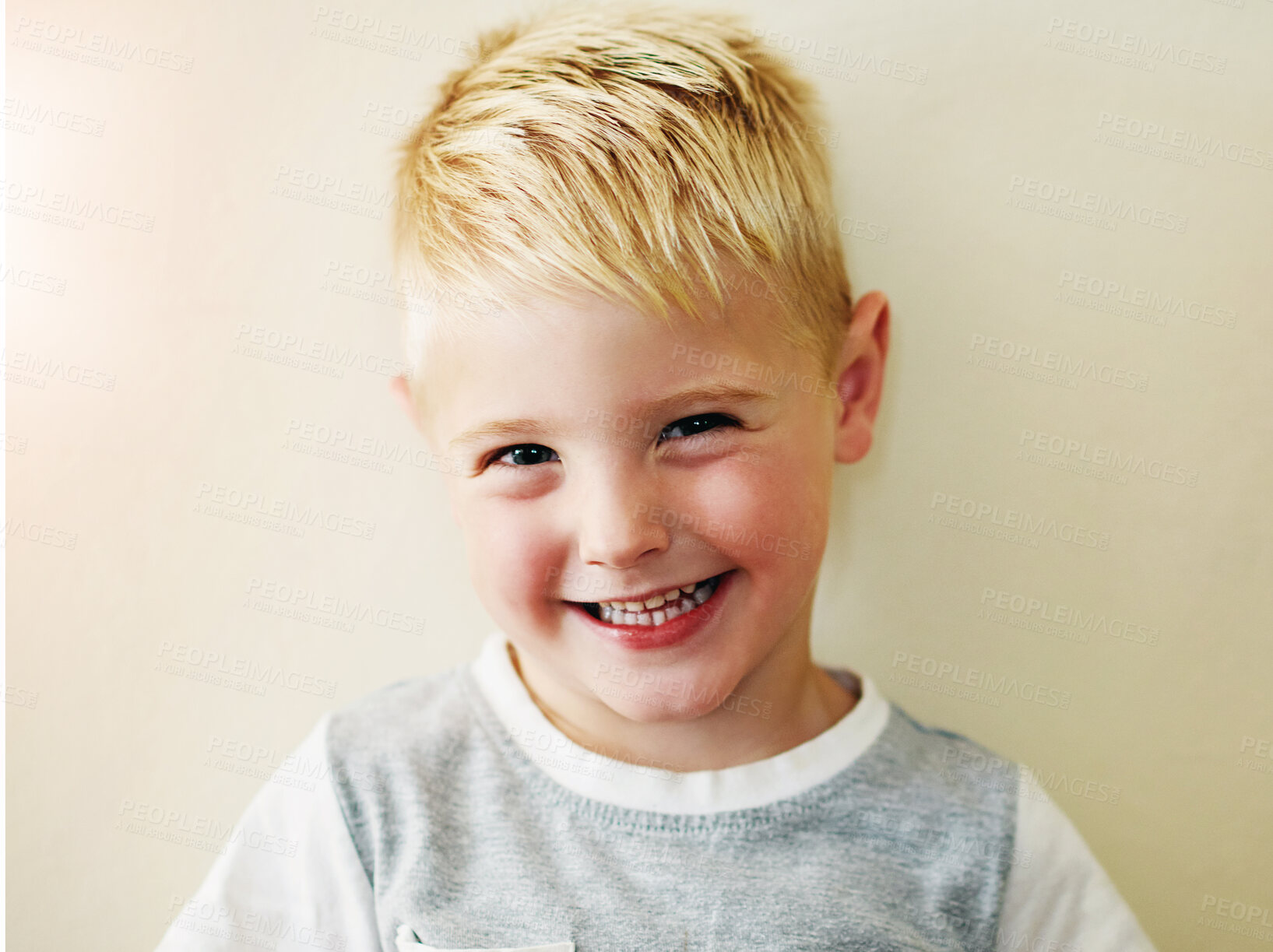 Buy stock photo Portrait, boy and smile in studio for wellness and happiness,  cute and excited face on white background. Kid, confidence and positive for childhood development, joyful and relaxed expression 