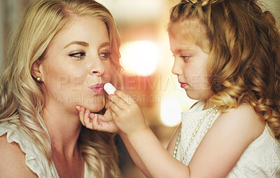 Buy stock photo Lipstick, mother or child play with makeup in home for beauty, care or family bonding together. Girl, mom or kid apply lip cosmetics on face, learning or parent teaching daughter to paint in bathroom