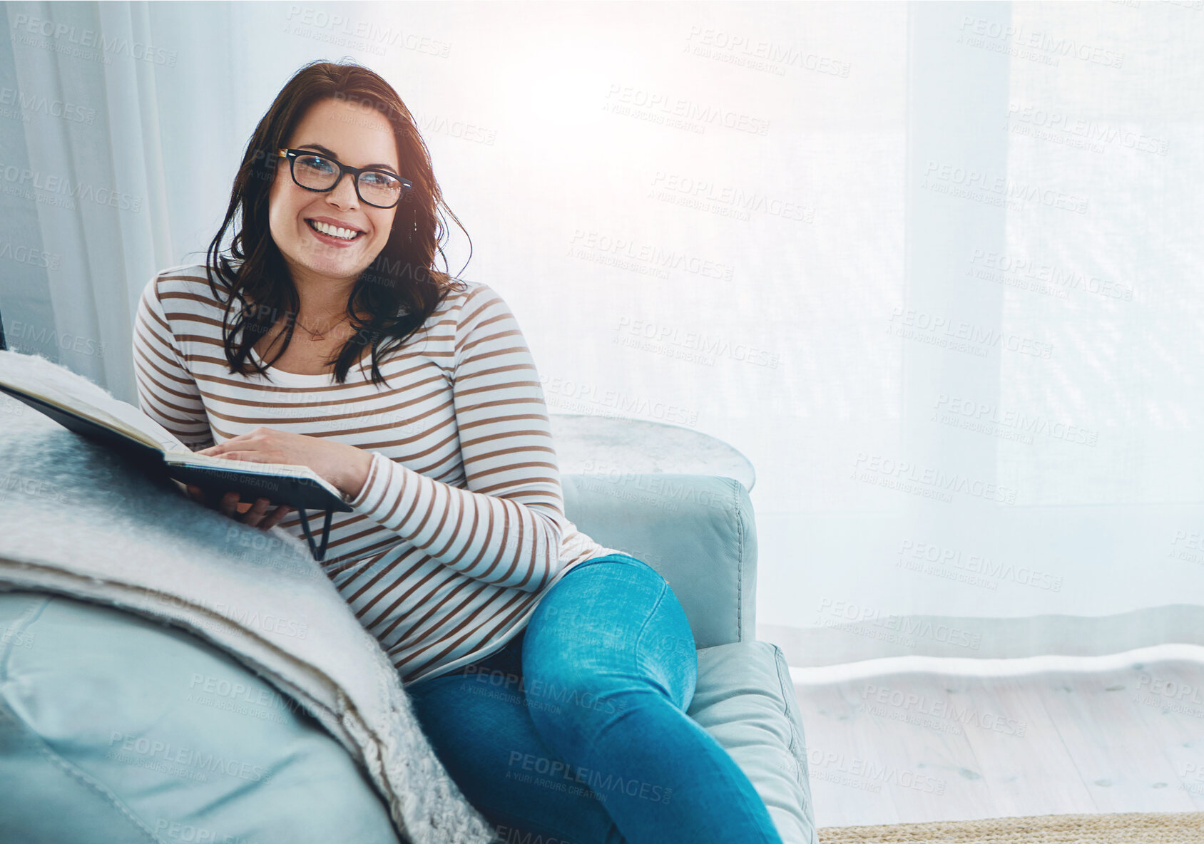 Buy stock photo Happy woman, relax and reading with book in home for story, knowledge or literature on sofa. Female person, nerd or geek with smile, glasses or novel on living room couch for comfort or information