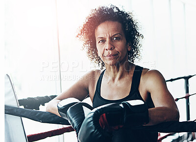 Buy stock photo Mature woman, boxer and portrait for fitness, exercise or training workout ready for fight at gym. Female fighter, boxing and competitive sports for ring match, health and wellness with endurance