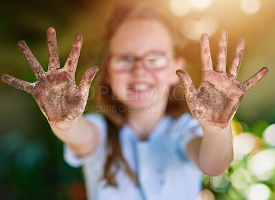 Buy stock photo Portrait, hands and kid with soil, environment and sunshine with nature, climate change and playful. Face, girl and fun with childhood, dirt and muddy with mess, outdoor and summer with weekend break