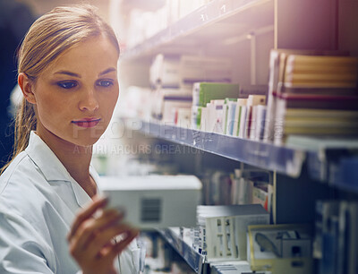 Buy stock photo Pharmacy, shelf and woman with box of drugs, pills or search for prescription medicine inventory. Pharmacist, reading and working in shop with sale of medical product for healing or healthcare