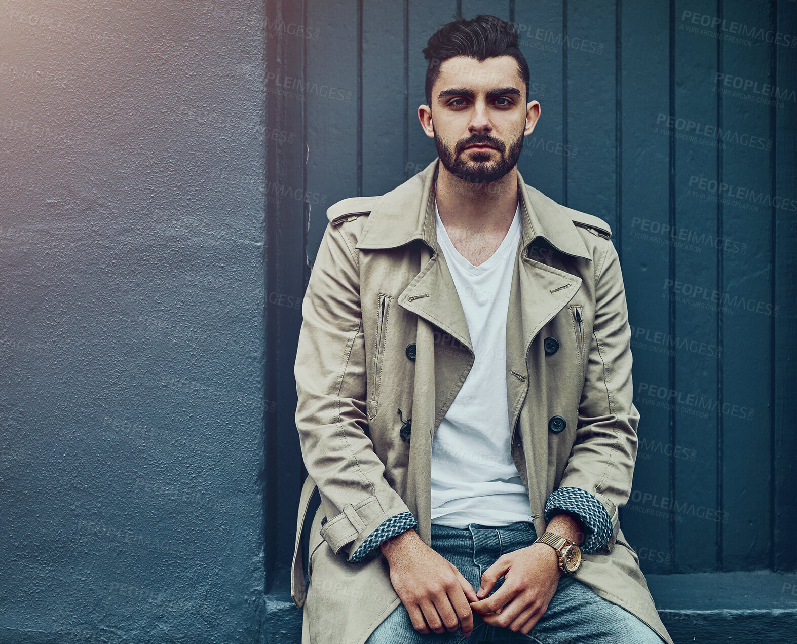 Buy stock photo Portrait, fashion and man on wall in city for streetwear, stylish jeans or trendy coat on background space in Spain. Serious, confidence and barber in urban clothes outdoor for travel and tourism