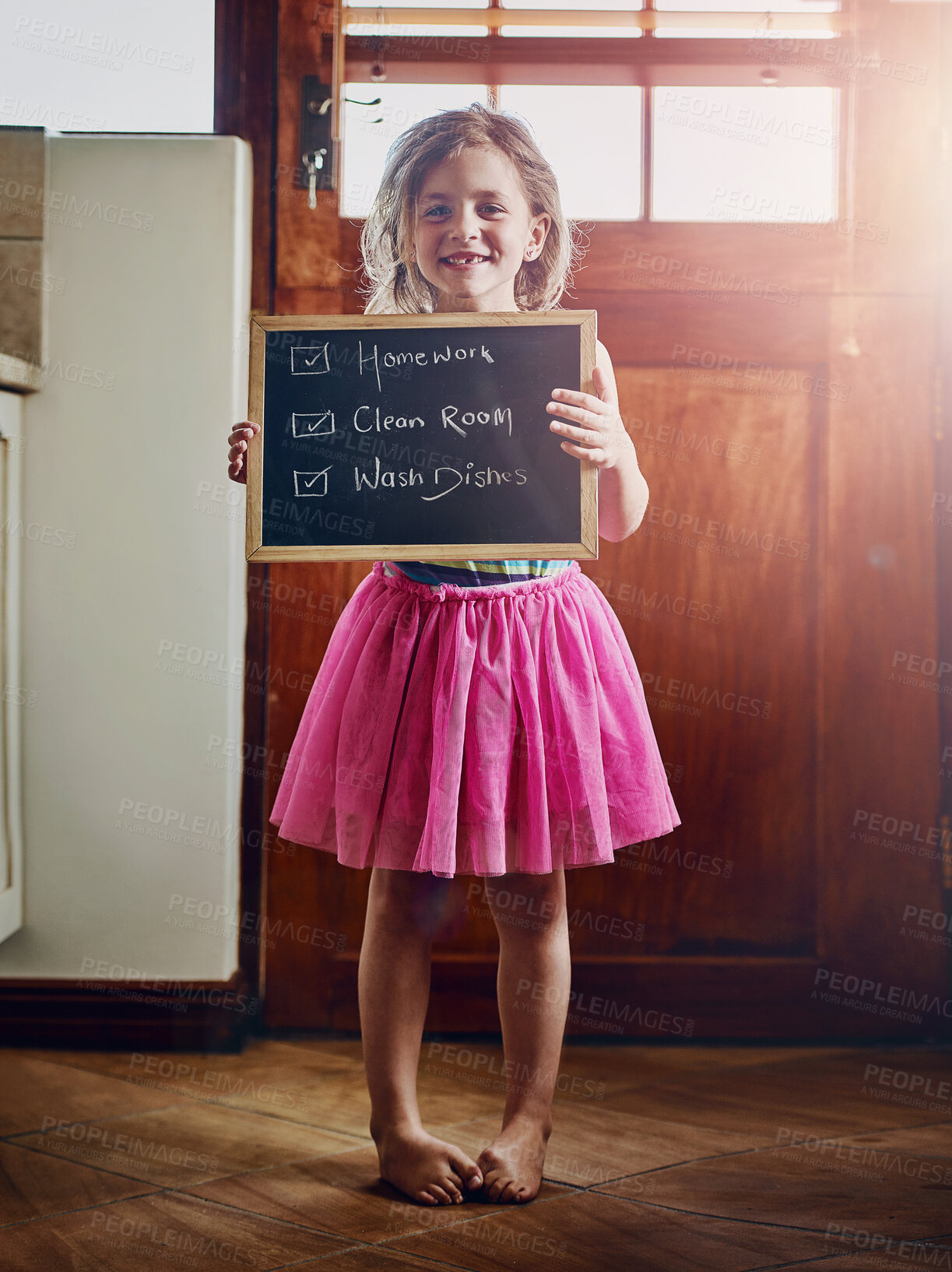 Buy stock photo Girl, child and chalkboard for chores in home with checklist of housework responsibility or helping hand. Portrait, kid and proud with to do list in house for development, growth or learning to clean