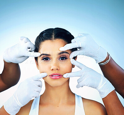 Buy stock photo Hands, gloves and portrait of girl for plastic surgery, skincare and face consultation in studio. Female model, filler and cosmetology by doctors for facial change, dermatology and blue background