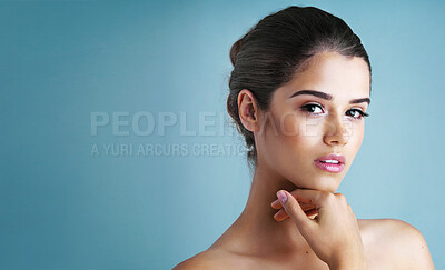 Buy stock photo Mockup, skincare and portrait of woman in studio with natural beauty, confidence and luxury cosmetics. Dermatology, facial care and girl with glow, makeup and healthy skin on blue background space.