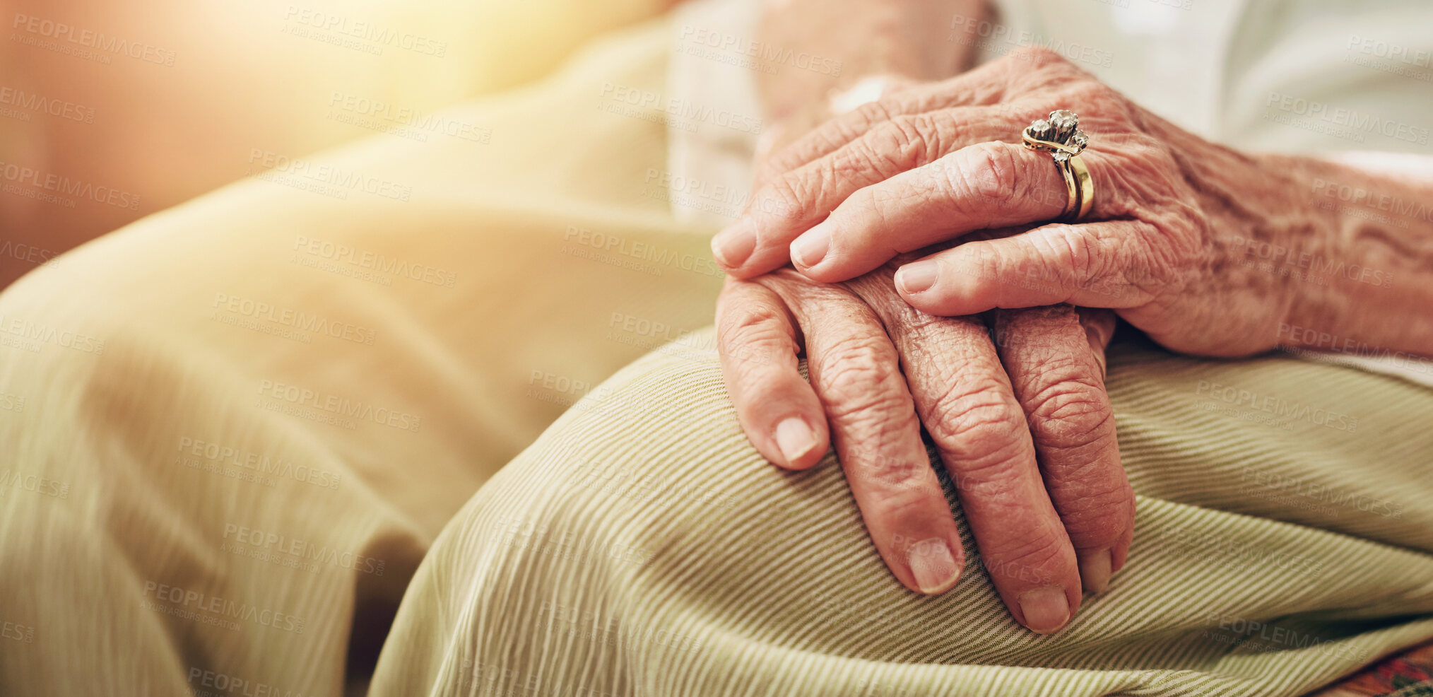 Buy stock photo Closeup, morning and hands of senior woman in retirement home for thinking, reflection and nostalgia in house. Old age, living room and elderly person with ring for relaxing, calm and widow on sofa