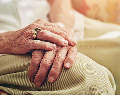 Buy stock photo Closeup, sofa and hands of senior woman in retirement home for thinking, reflection and nostalgia in house. Old age, living room and elderly person on couch for relaxing, calm and peace in morning