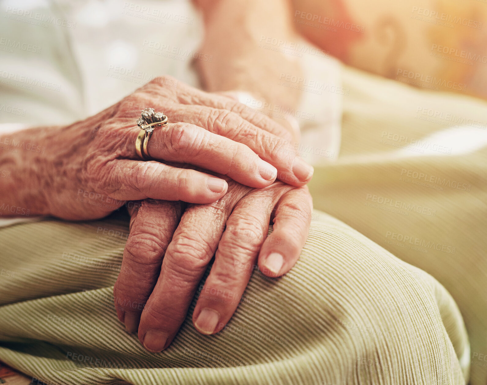 Buy stock photo Closeup, sofa and hands of senior woman in retirement home for thinking, reflection and nostalgia in house. Old age, living room and elderly person on couch for relaxing, calm and peace in morning