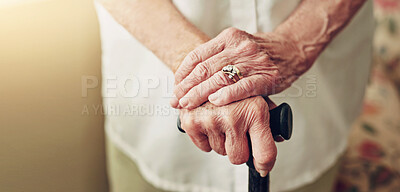 Buy stock photo Hands, walking stick and closeup with senior woman, injury and disabled with balance in retirement in house. Cane, elderly lady and person with disability, support or recovery in home with lens flare