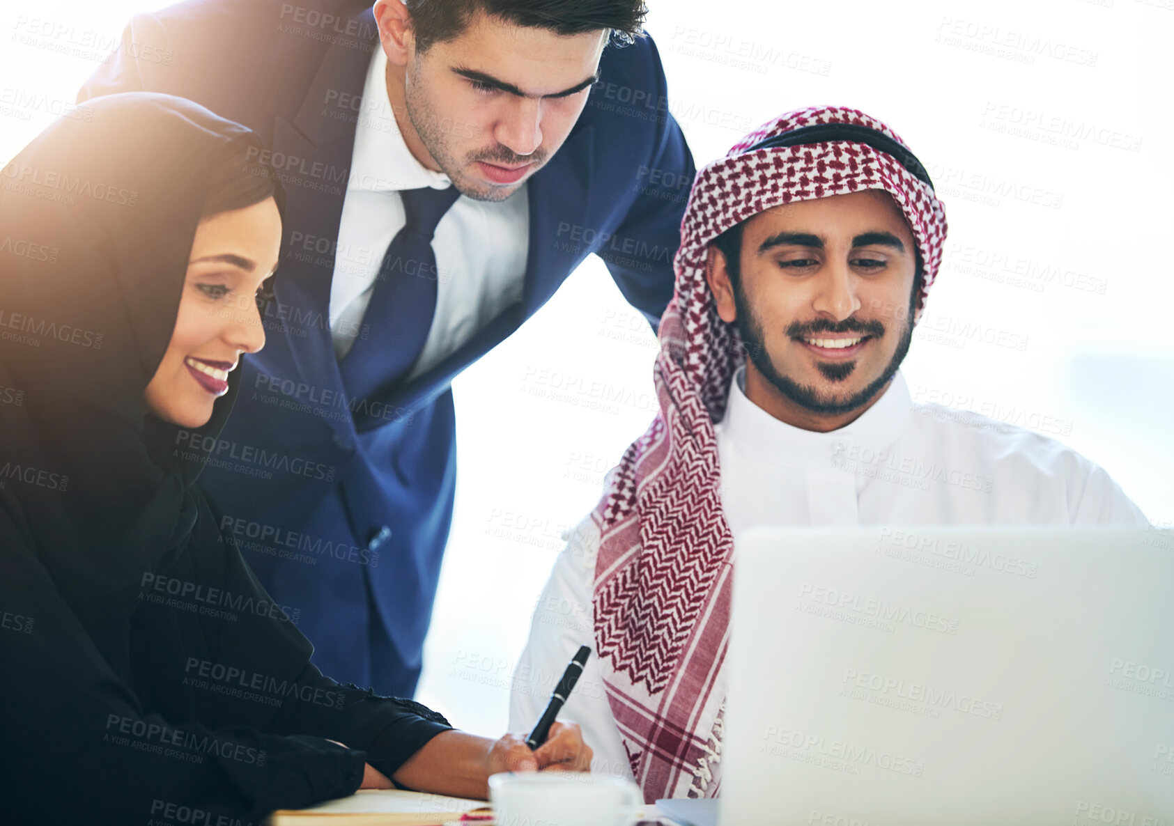 Buy stock photo Muslim, employee and laptop in office for teamwork, discussion and partnership for b2b collaboration. Diversity, hijab woman and man coworker for online project, professional communication in Dubai