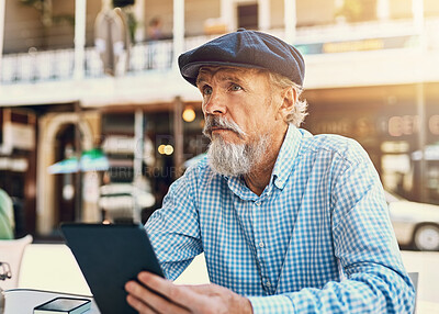 Buy stock photo Cafe, table and senior man with tablet in city for website, search and digital news in morning. Person, thinking and communication with tech at coffee shop for media, online and review of restaurant