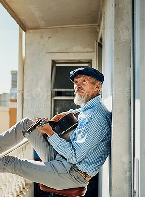 Buy stock photo Senior, man and artist with acoustic guitar for playing with retired musician on balcony in town for memories. Creative, elderly and proud of accomplishments with blues or folk song in urban Italy.