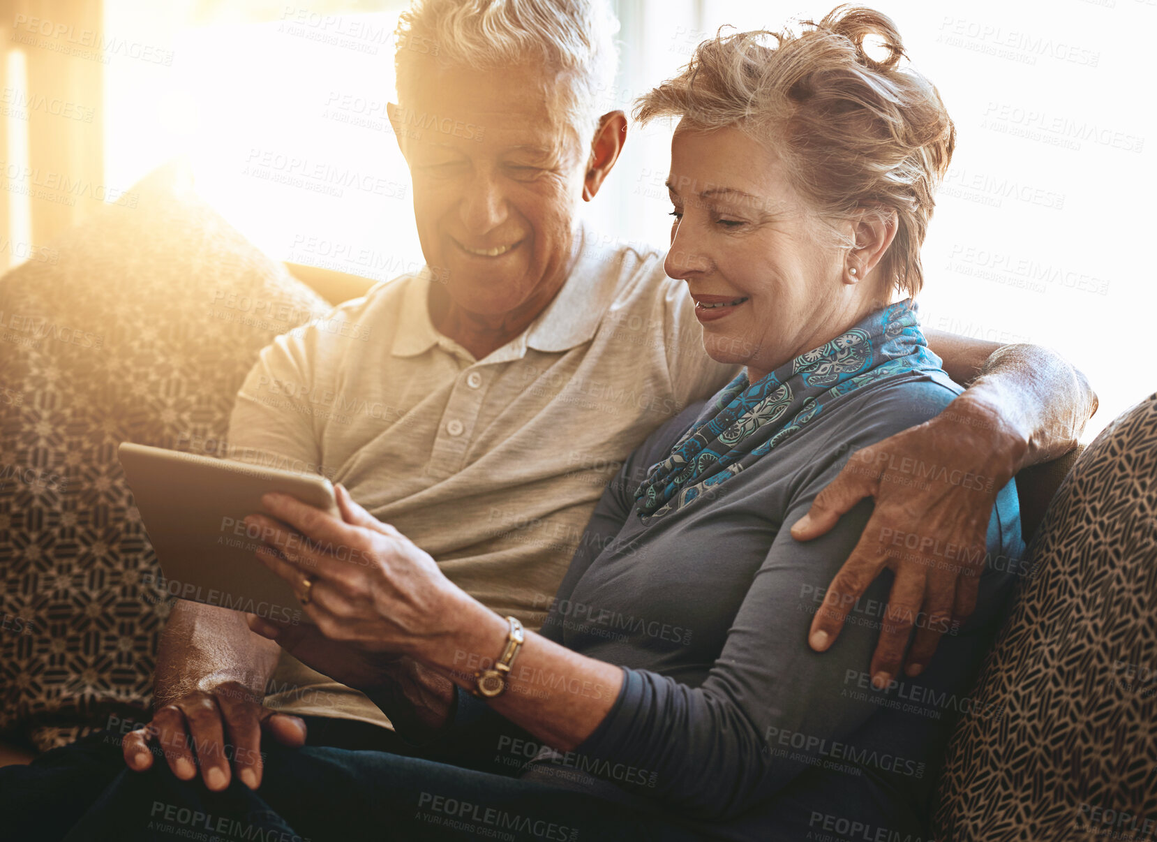 Buy stock photo Happy, senior couple and relax with tablet for browsing, research or reading news on sofa at home. Retired man, woman and smile with technology for online connectivity or retirement together at house