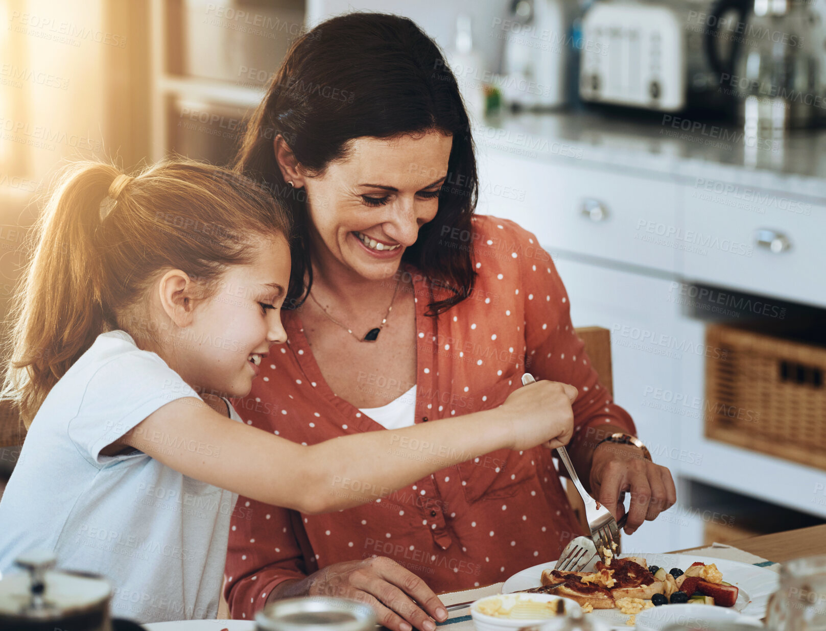 Buy stock photo Family, mother and daughter with food in dining room for healthy lunch, nutrition or bonding together. Lens flare, hungry and happy parent with young child for sharing, brunch or bread meal in home