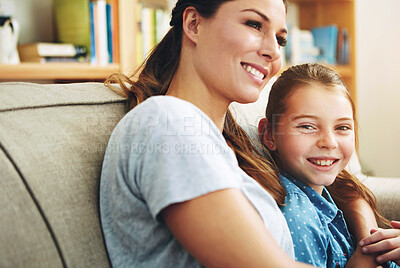 Buy stock photo Woman, kid and relax on sofa with hug in living room for support, care and bonding on weekend. Happy, family and mom with girl in embrace at home for motherhood, connection and love of daughter