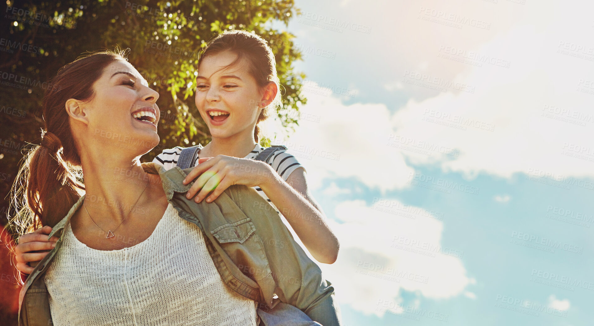 Buy stock photo Blue sky, kid and woman with piggyback in nature for travel, holiday and bonding together in forest. Low angle, fun and mother with daughter in park for support, love or child development on vacation