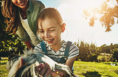 Buy stock photo Park, mother and girl with dog, play and sunshine with weekend break, happiness and nature. Family, single parent and mama with daughter, animal and pet with lens flare, fun and summer with smile