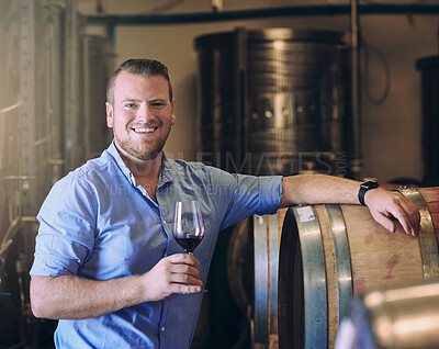 Buy stock photo Glass, portrait and smile with man in wine cellar for industry, manufacturing or production. Barrel, business and storage with happy sommelier at winery for distillation or fermentation of alcohol