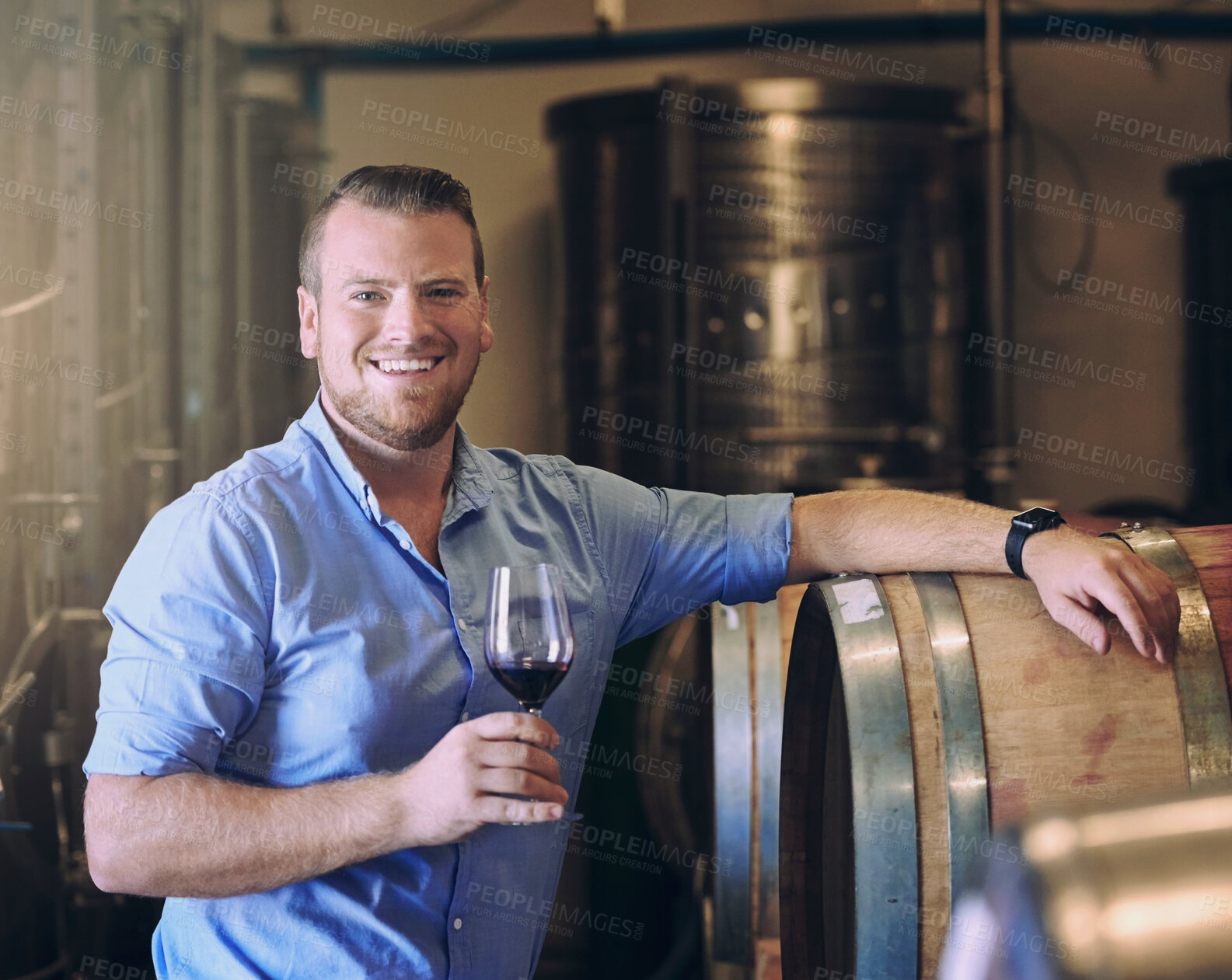 Buy stock photo Glass, portrait and smile with man in wine cellar for industry, manufacturing or production. Barrel, business and storage with happy sommelier at winery for distillation or fermentation of alcohol