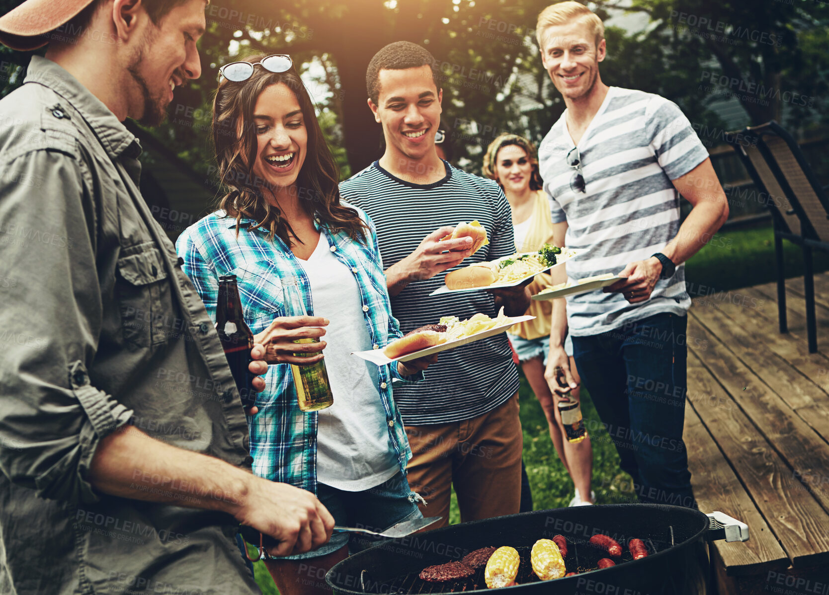 Buy stock photo Friends, drinks and barbecue with food for dinner, party or reunion with alcohol in America. Group, people and cheerful at bbq in backyard, summer and vacation for holiday, celebration or birthday