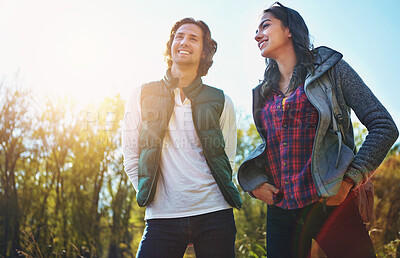 Buy stock photo Happy, young couple in park or nature together for holiday, vacation and romantic weekend break. Smiling, man and woman relax in forest or green environment for peace, freedom and summer travel 