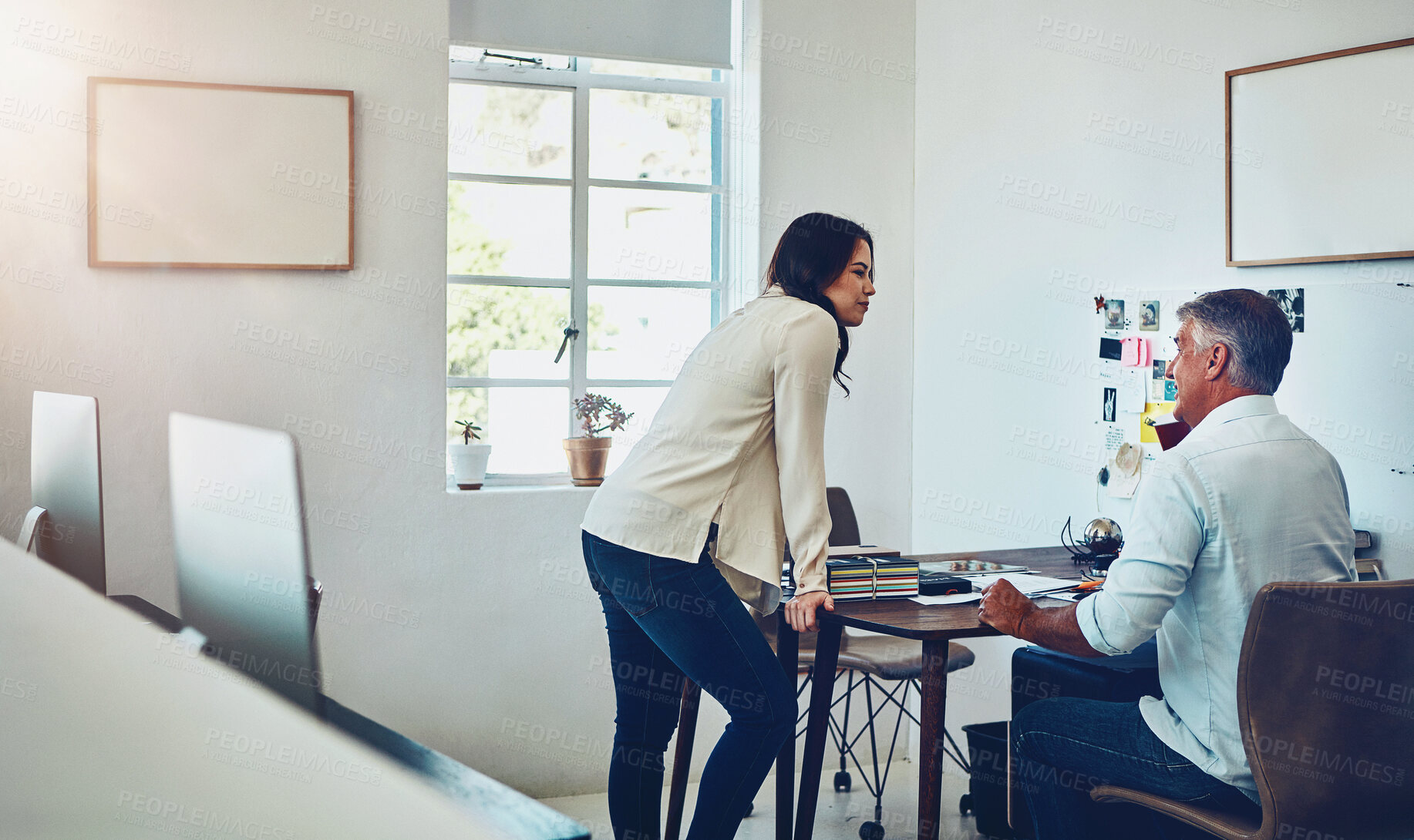 Buy stock photo Office, teamwork and business people by desk talking in office. Planning, collaboration and female employee with discussion for sales, marketing strategy with senior boss for growth in company