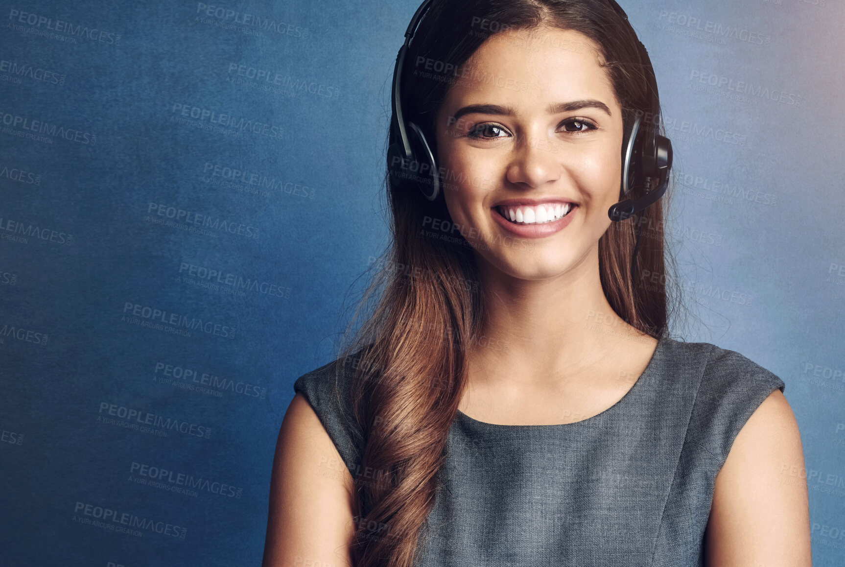 Buy stock photo Girl, happy and studio portrait for call center work, telemarketing career and virtual assistant for inbound sales company. Woman, blue background and mockup for contact us, communication and support