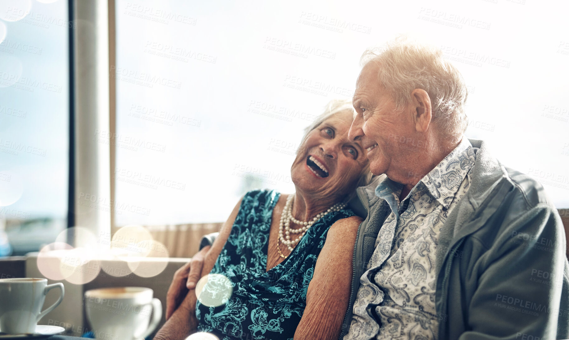 Buy stock photo Happy, elderly couple and laughing on coffee date in cafe together for bonding and funny joke in retirement. Smile, senior man and woman with bokeh and morning espresso for relax, peace and humour