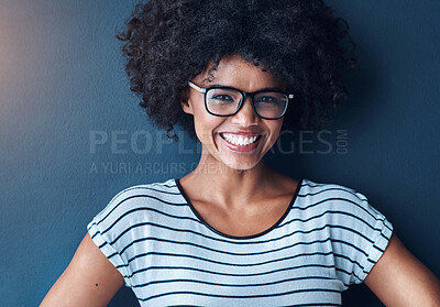 Buy stock photo Portrait, afro and black woman with glasses, fashion and happiness on blue studio background. African person, face and model with eyewear, gen z and casual outfit with smile, stylish clothes and joy