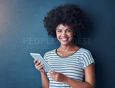 Buy stock photo African woman, tablet and happy in studio portrait, communication and studying with app by blue background. Person, girl and click on digital touchscreen, online course and e learning for education