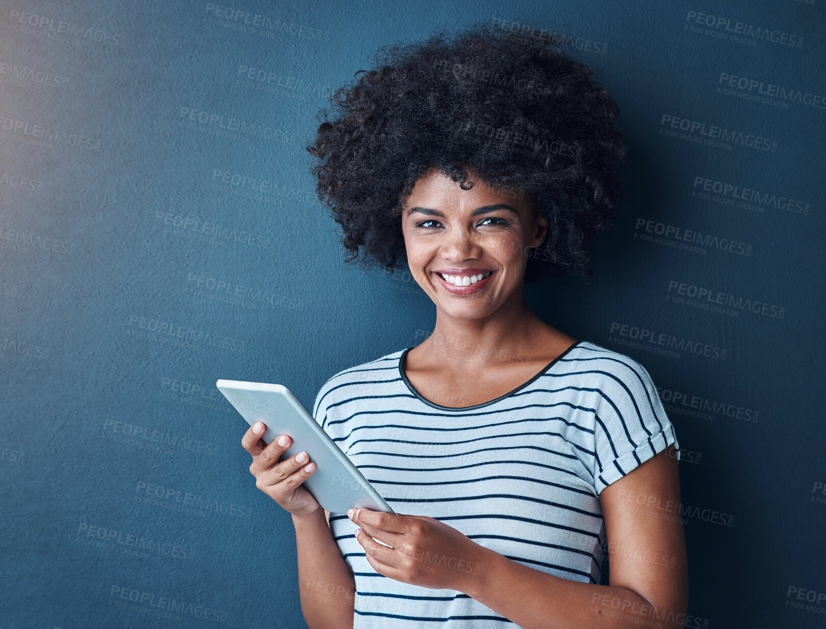 Buy stock photo African woman, tablet and happy in studio portrait, communication and studying with app by blue background. Person, girl and click on digital touchscreen, online course and e learning for education