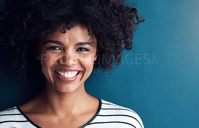 Buy stock photo Happy, laugh and portrait for African woman, studio and confidence for smile and joy. Excited, pride and face with isolated person for cheerful, joy and positive fun attitude on blue background