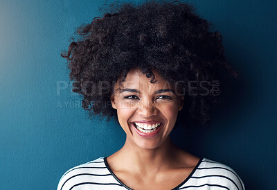 Buy stock photo Black woman, portrait and smile with funny, glow and confident on blue studio background. Girl, face and model with afro laughing for joke, comic and happiness or positive with natural beauty 