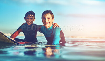 Buy stock photo Kids, portrait and happy in water for surfing, sports and and wellness with board, blue sky and smile. Boys, excited and swimming at beach as surfer for waves, fitness and summer while on vacation