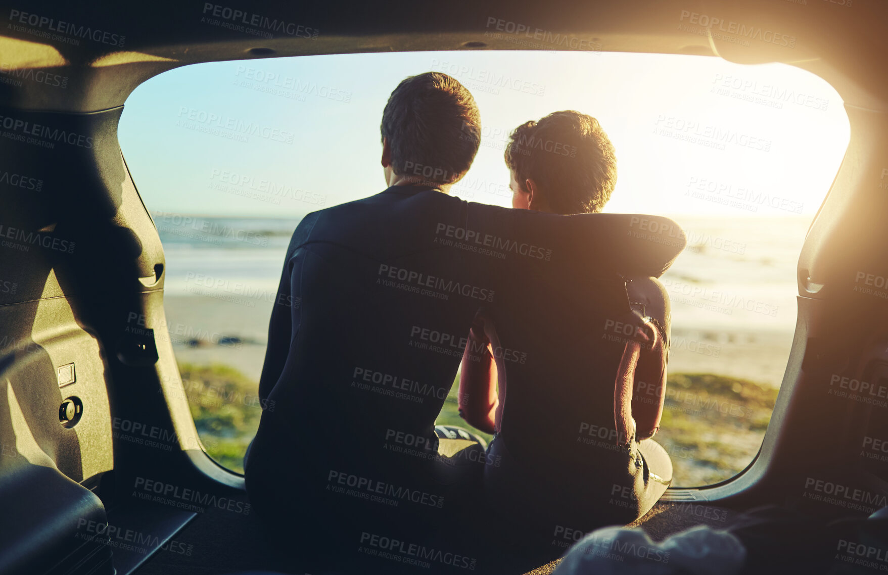 Buy stock photo Boys, sunset and relax in car at beach with hug, bonding and love in summer for travel road trip with ocean. Family, back view and sunshine in transport, tropical vacation and sunrise adventure