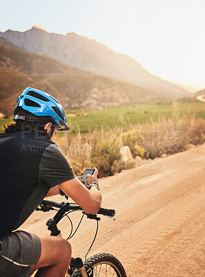 Buy stock photo Nature, smartphone and man with bicycle for fitness, exercise and training for wellness or health. Back, male cyclist or cellphone for trail navigation, searching GPS or direction in countryside