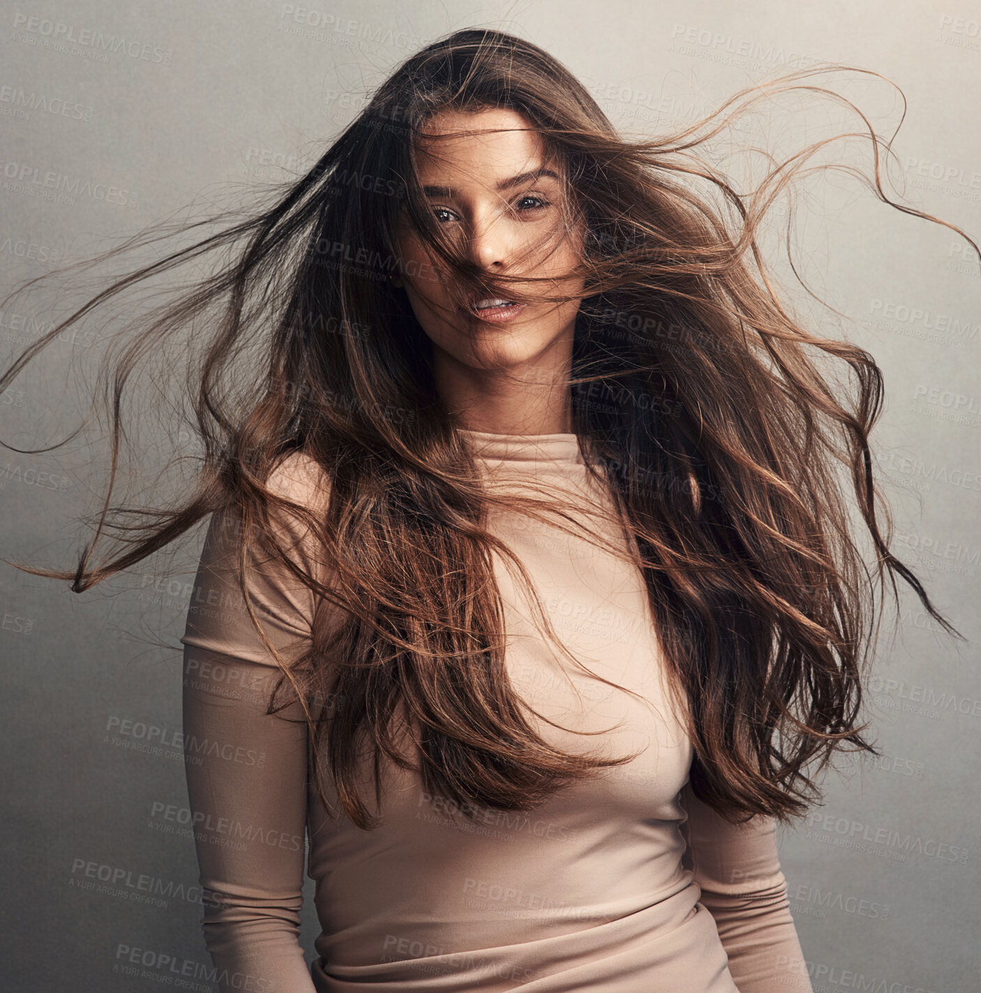 Buy stock photo Wind, hair care and portrait of woman for natural growth, cosmetics results and confidence in studio. Flow, breeze and face of proud girl model on grey background for conditioner, texture and beauty